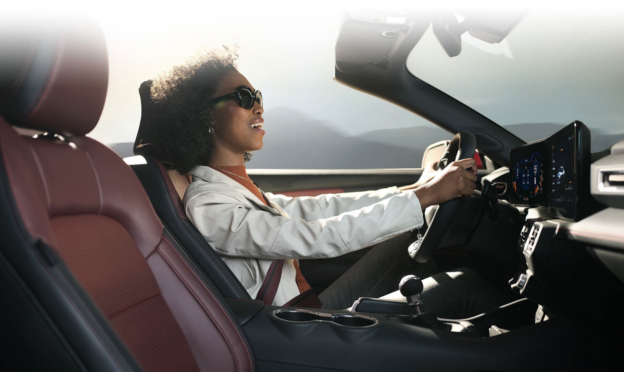 Person sitting in the driver’s seat of a 2024 Ford Mustang® convertible | Ed Morse Ford in Muscatine IA