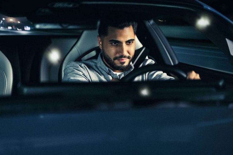 Person sitting in the driver’s seat of a parked 2024 Ford Mustang® coupe | Ed Morse Ford in Muscatine IA
