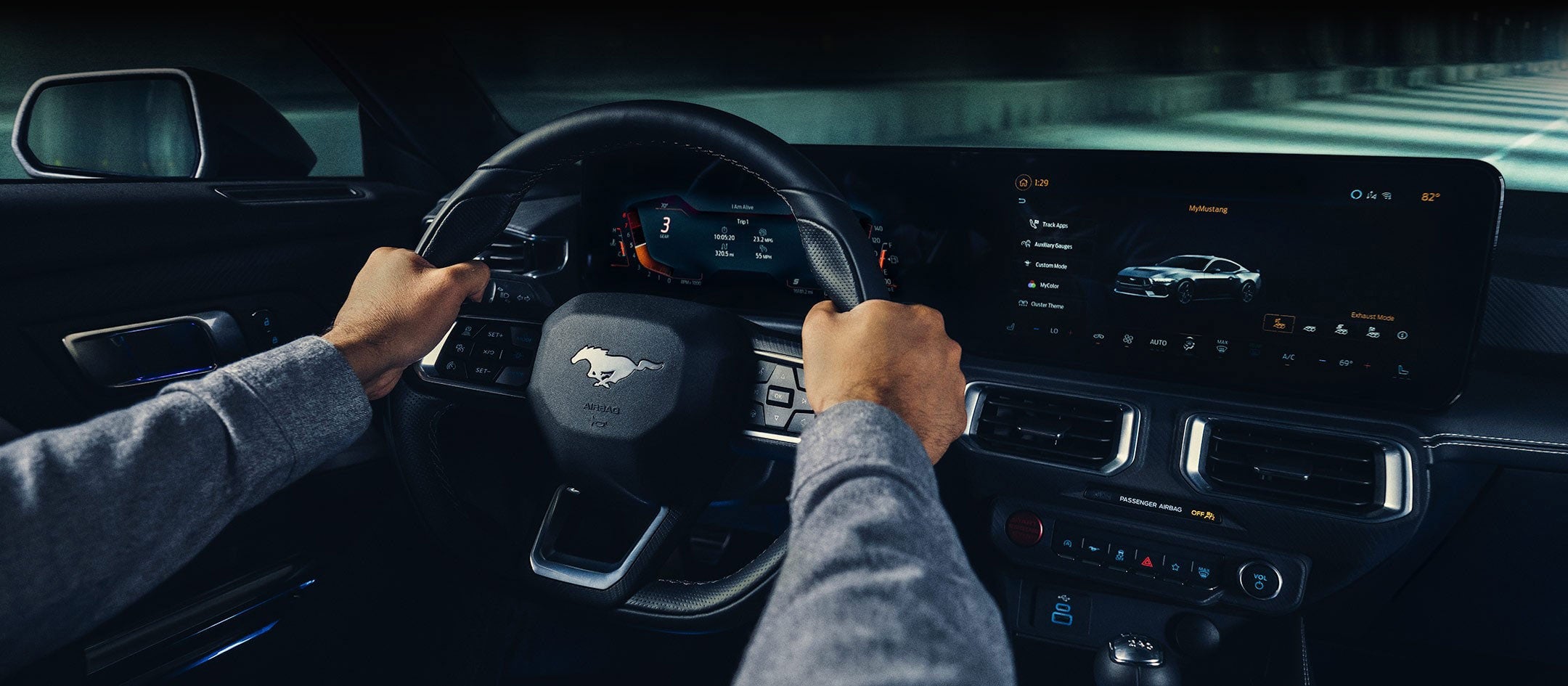 A 2024 Ford Mustang® model interior with a person driving | Ed Morse Ford in Muscatine IA
